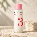 Toner Numbuzin sur travertin ivoire.webp
